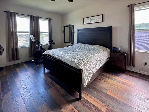 a bed room with a bed and a chandelier