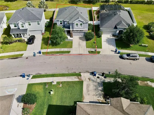 an aerial view of a house with a garden