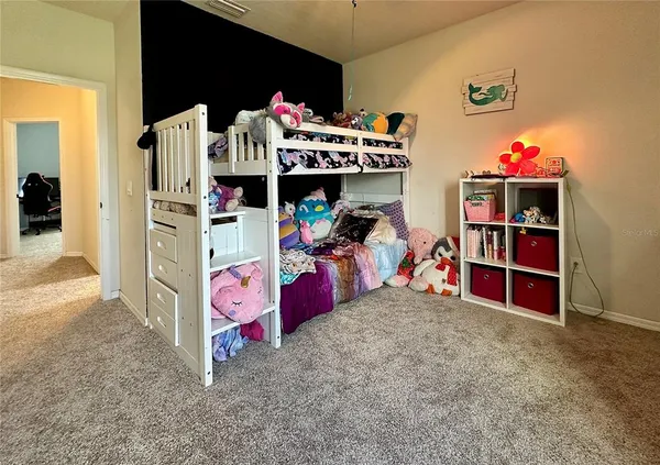 a view of a room with toys and a window