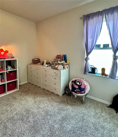 a bathroom with a double vanity sink a toilet and a mirror