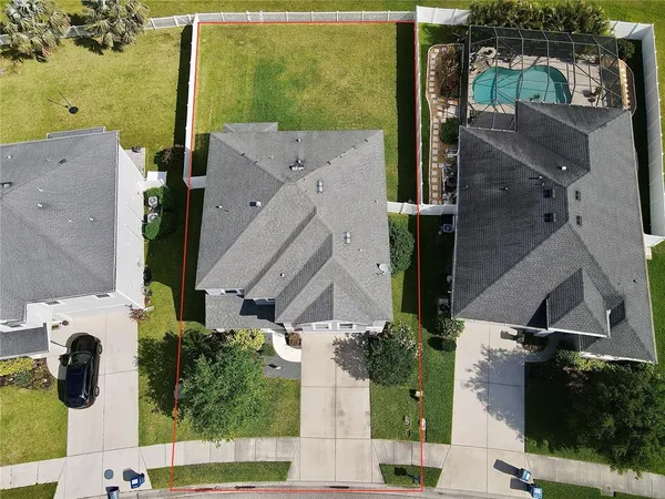 an aerial view of houses with outdoor space