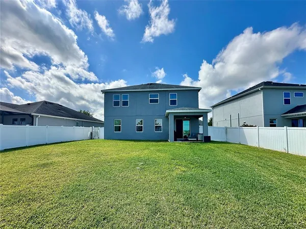a view of a house with a big yard