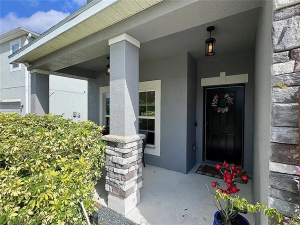 front view of a house with a chairs