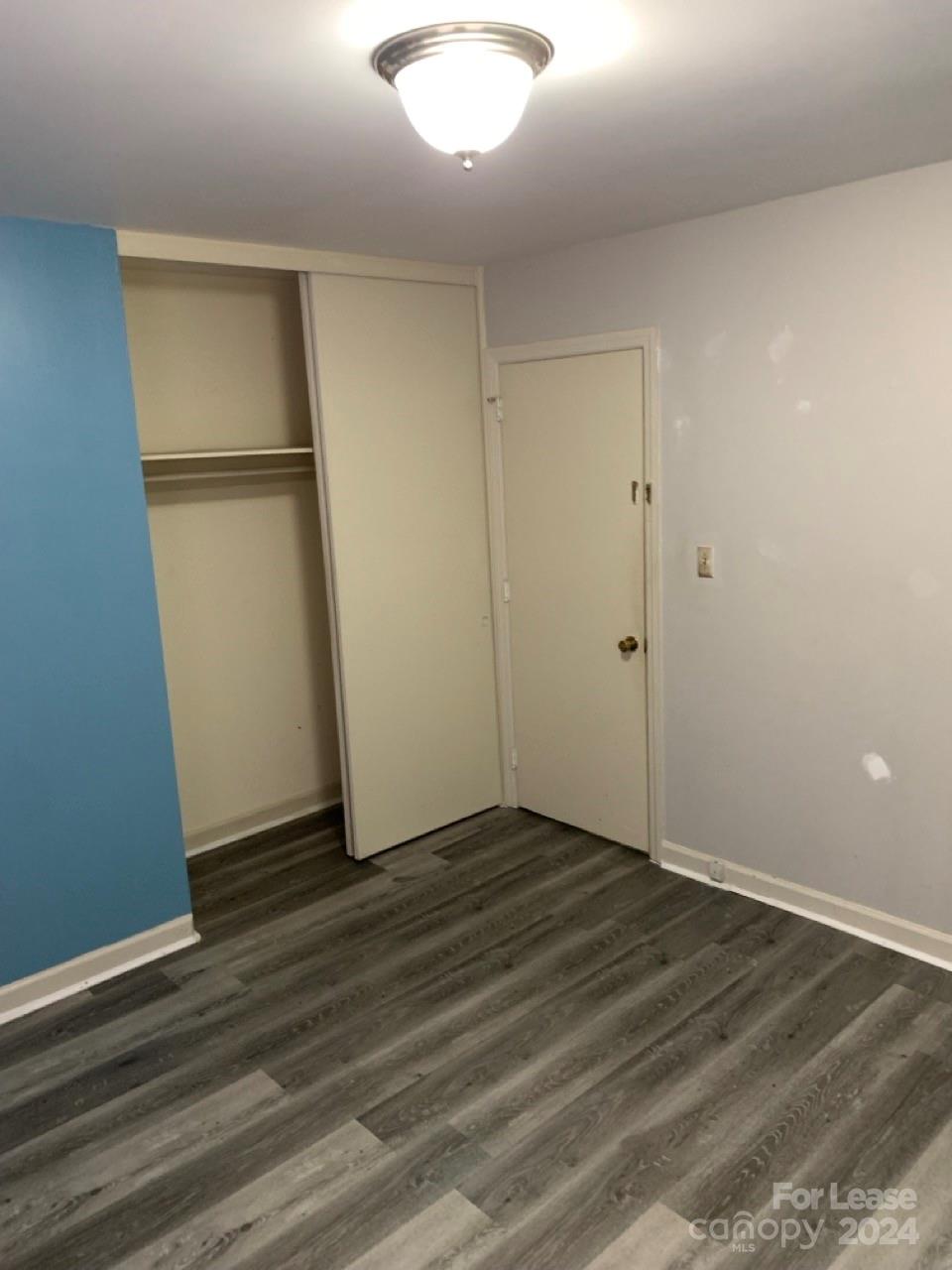 44177 B Mountain View Church Road Albemarle, NC 28001 - Photo 15 of 26 an empty room with wooden floor and entrance