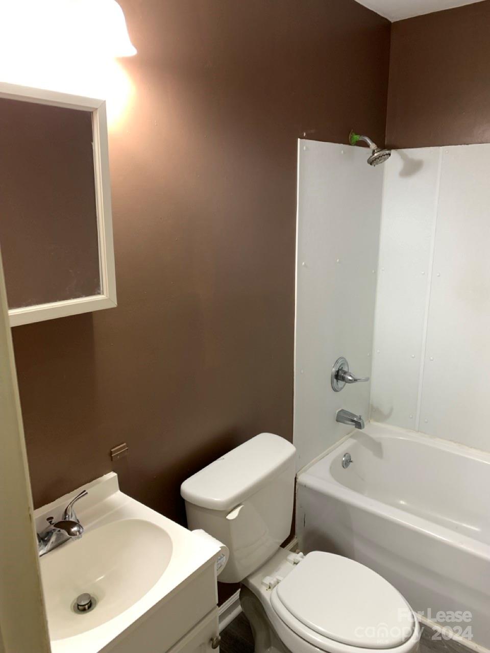 44177 B Mountain View Church Road Albemarle, NC 28001 - Photo 18 of 26 a white toilet sitting next to a bath tub