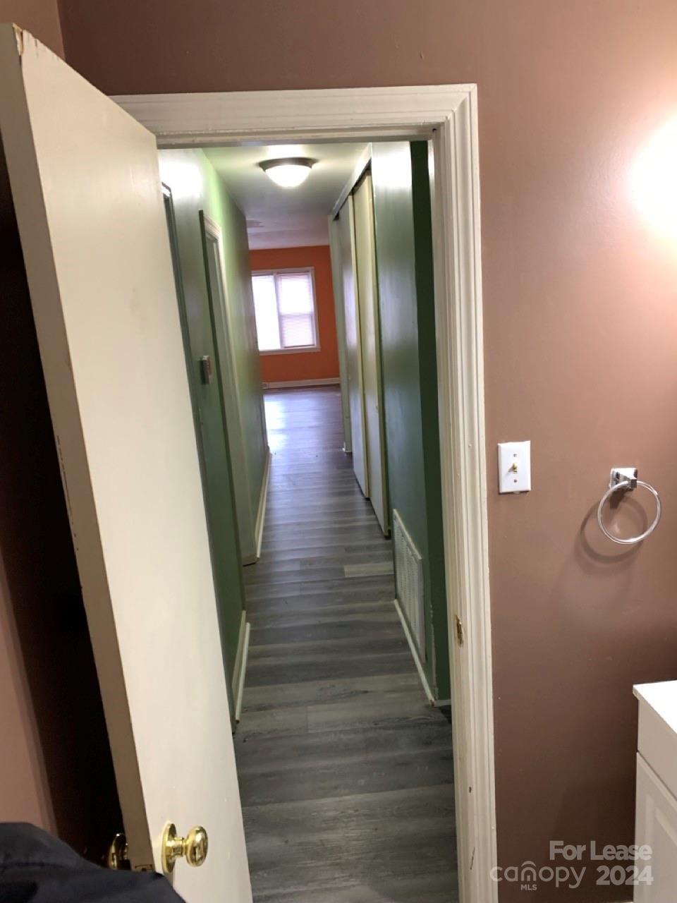 44177 B Mountain View Church Road Albemarle, NC 28001 - Photo 20 of 26 a view of a hallway with wooden floor and staircase