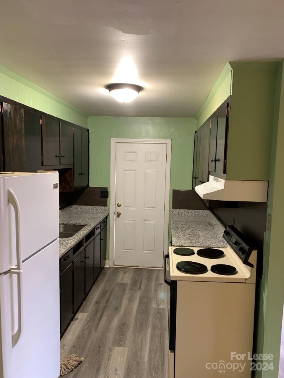 44177 B Mountain View Church Road Albemarle, NC 28001 - Photo 2 of 26 a kitchen with stainless steel appliances granite countertop a stove a refrigerator and a microwave