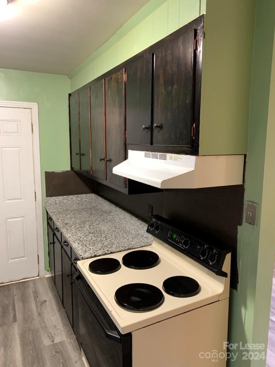44177 B Mountain View Church Road Albemarle, NC 28001 - Photo 3 of 26 a kitchen with a sink a stove and a refrigerator