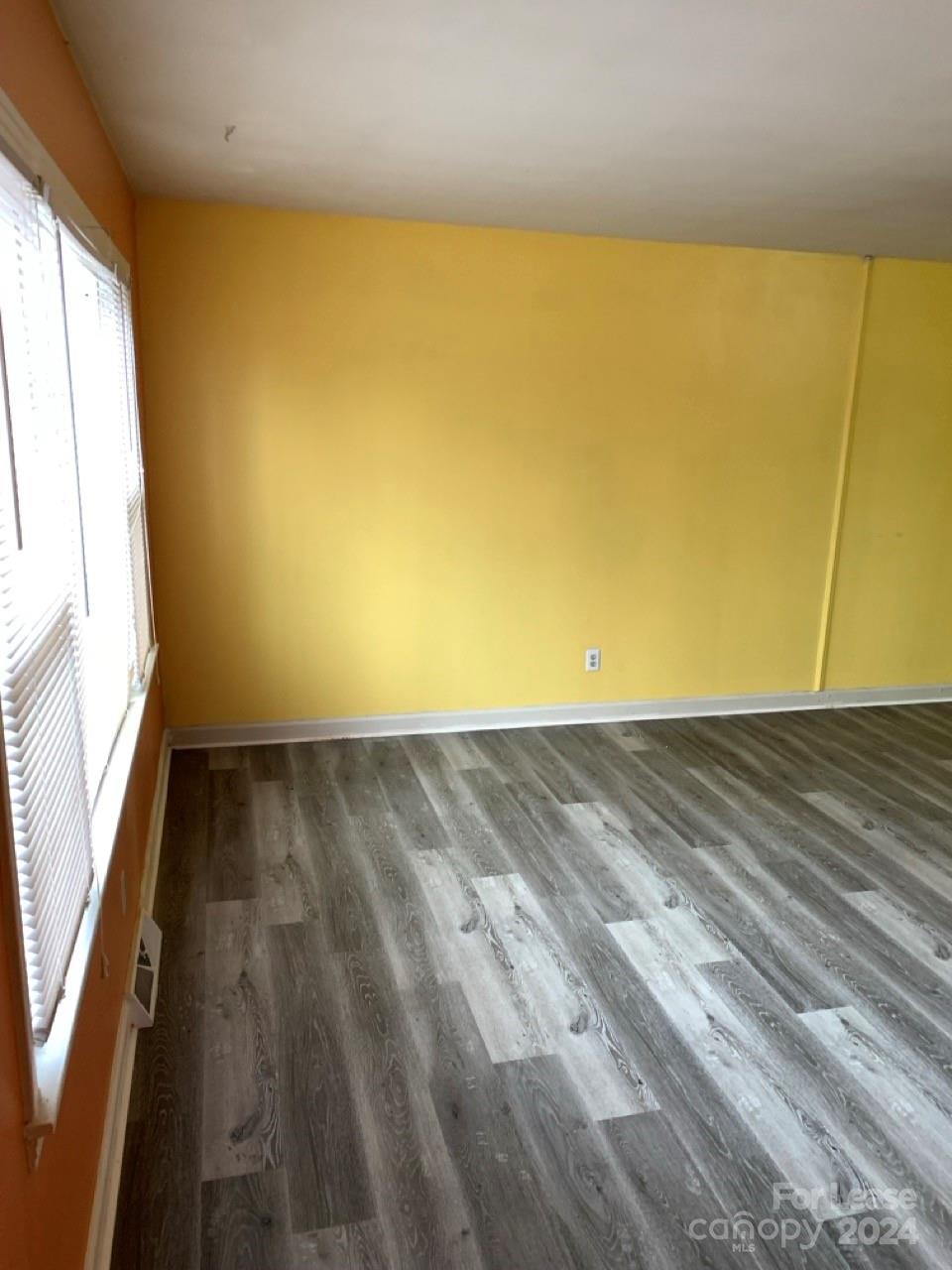 44177 B Mountain View Church Road Albemarle, NC 28001 - Photo 5 of 26 a view of a big room with wooden floor and windows