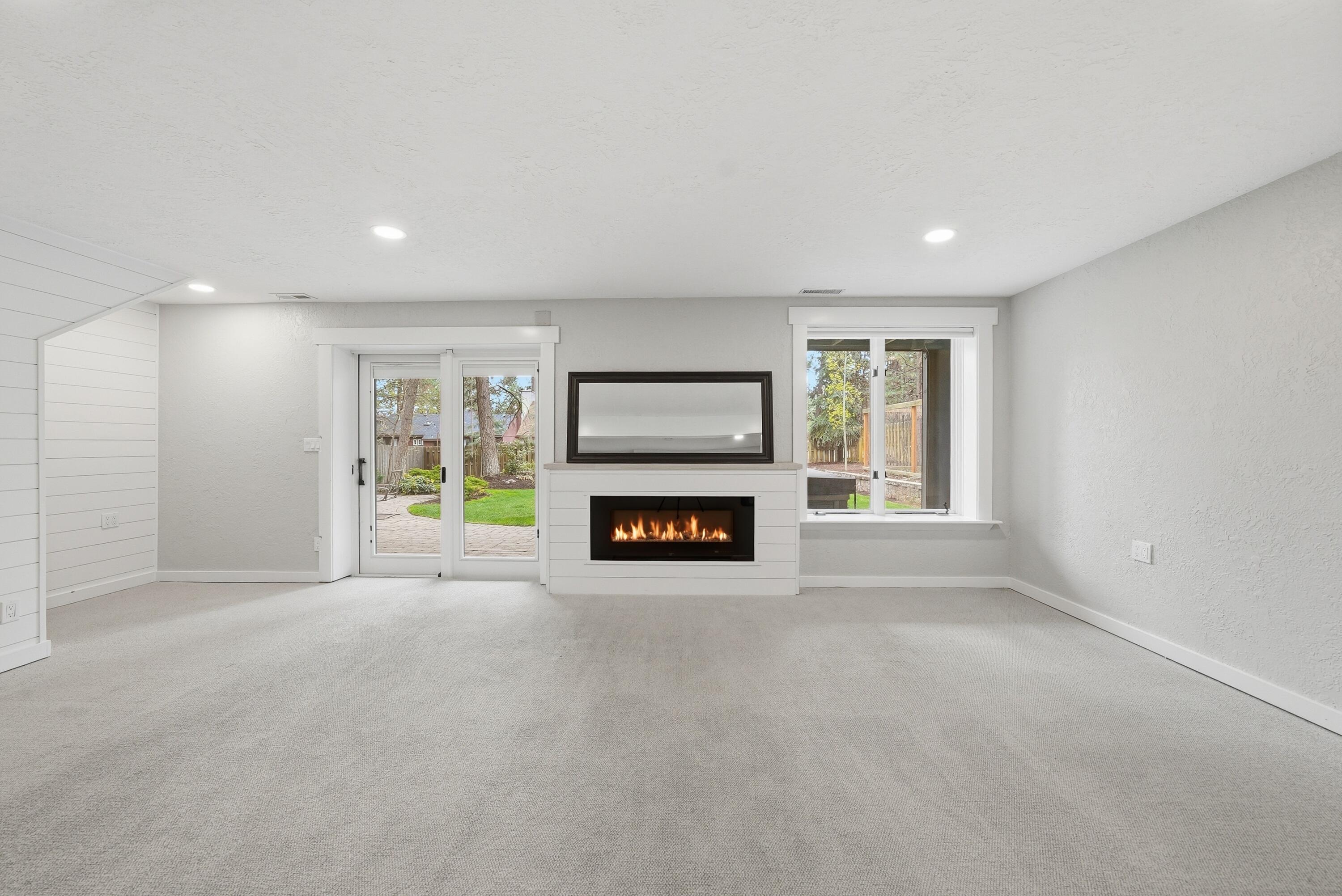 1961 Southwest Knoll Avenue Bend, OR 97702 - Photo 29 of 53 a view of an empty room with a fireplace and a window