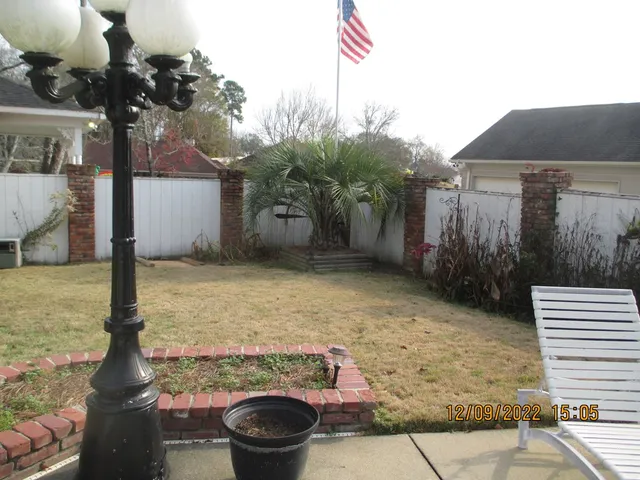 a backyard of a house with lots of green space