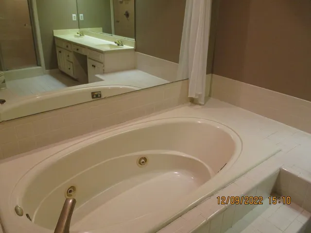 a bathroom with a bathtub and a sink