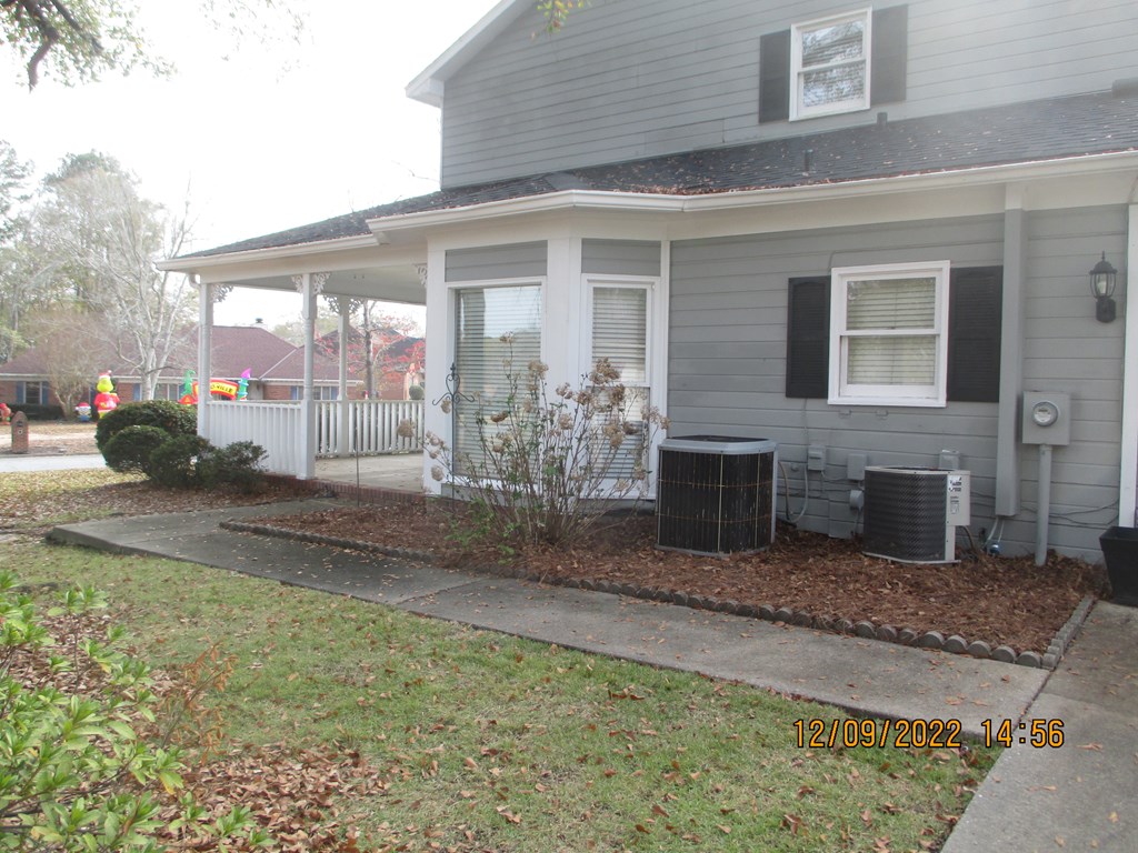 7201 West Wynfield Loop Midland, GA 31820 - Photo 3 of 34 a front view of a house with garden