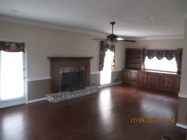a view of fireplace and window in a room