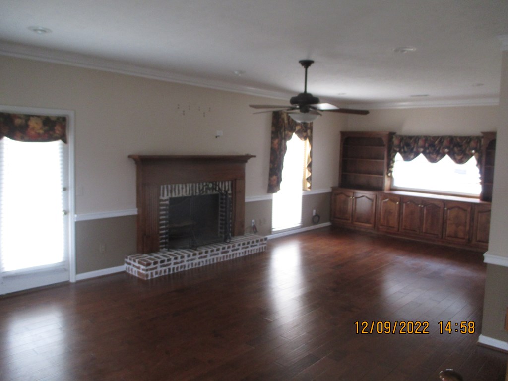 7201 West Wynfield Loop Midland, GA 31820 - Photo 6 of 34 a view of fireplace and window in a room