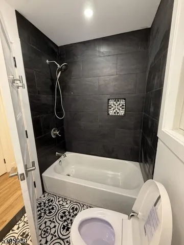 a bathroom with a sink a toilet and bathtub