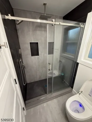 a bathroom with a tub and a shower