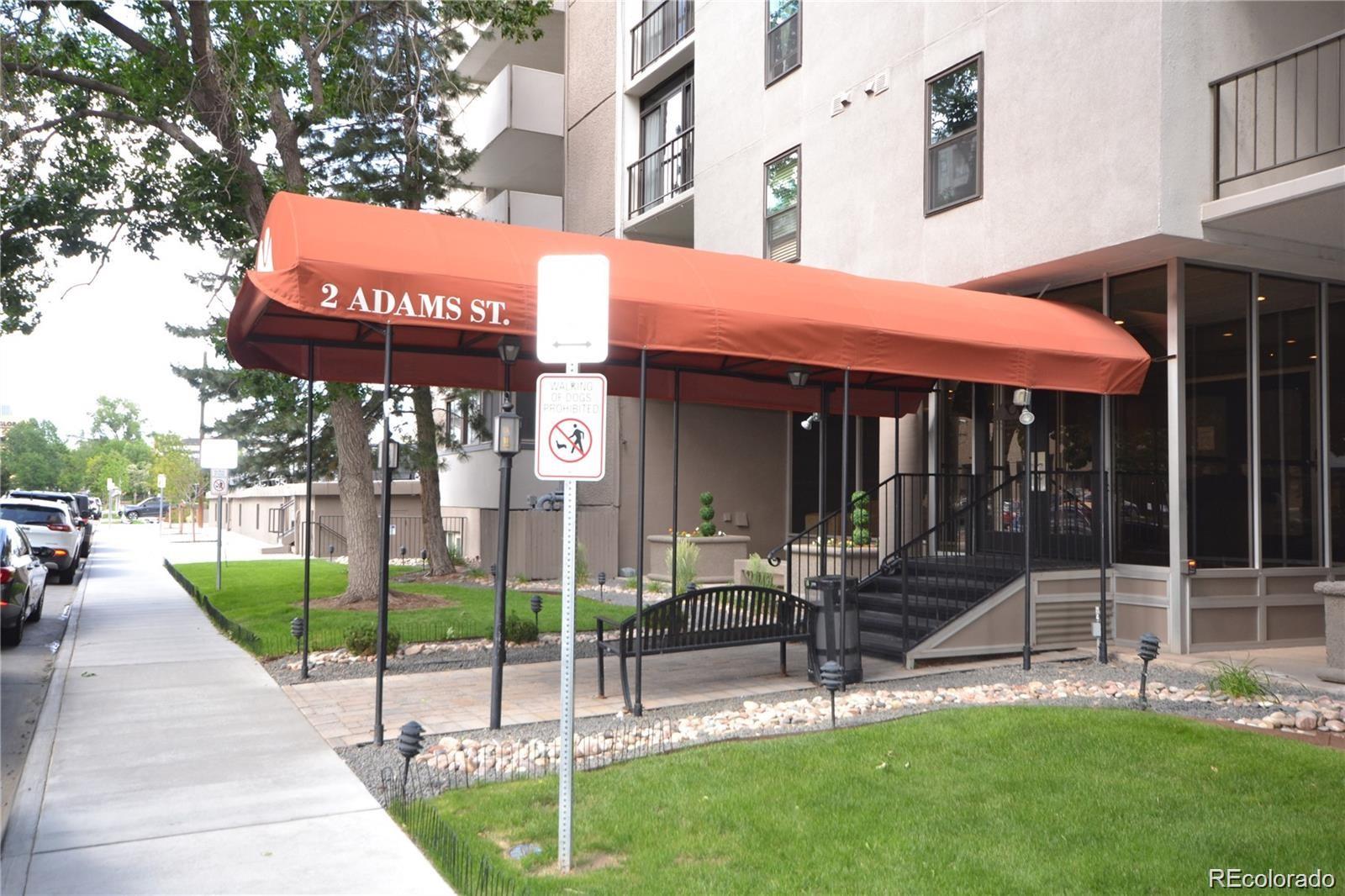 a view of a chairs and table in backyard