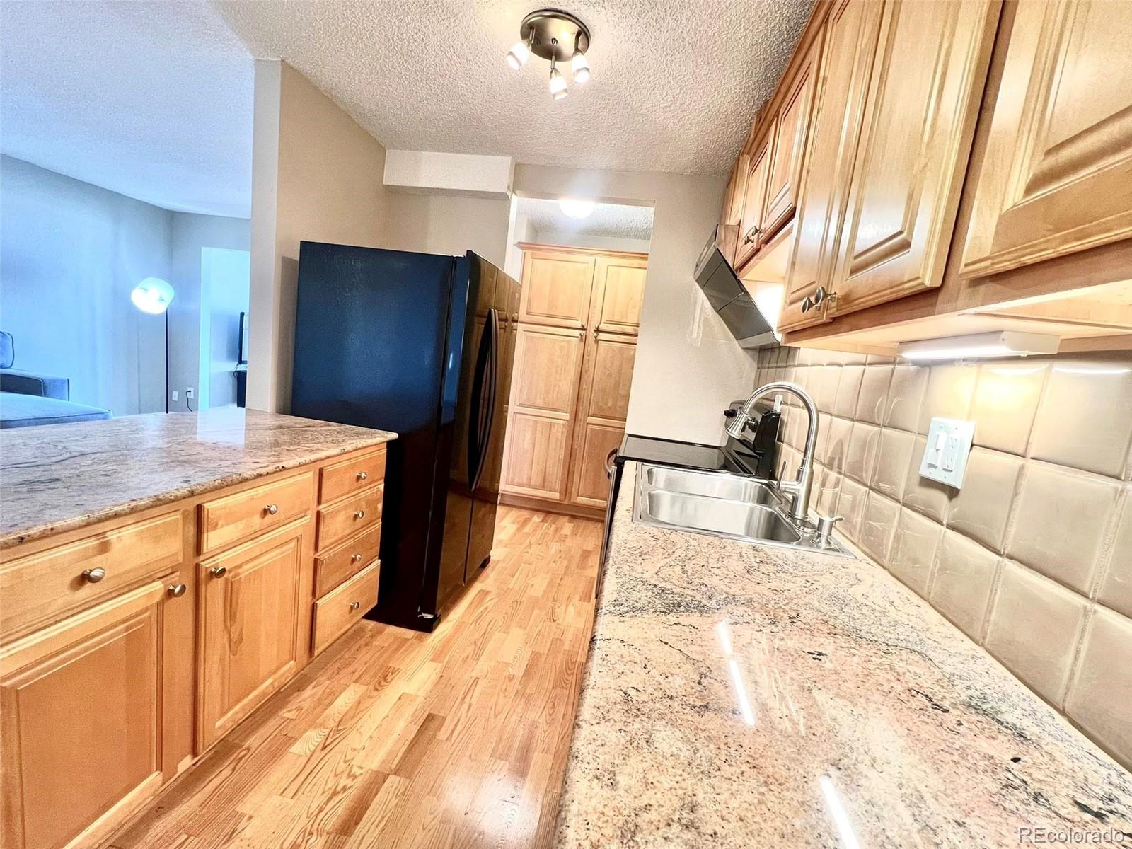 2 Adams Street, Unit 604 Denver, CO 80206 - Photo 11 of 41 a large bathroom with a sink and a large mirror