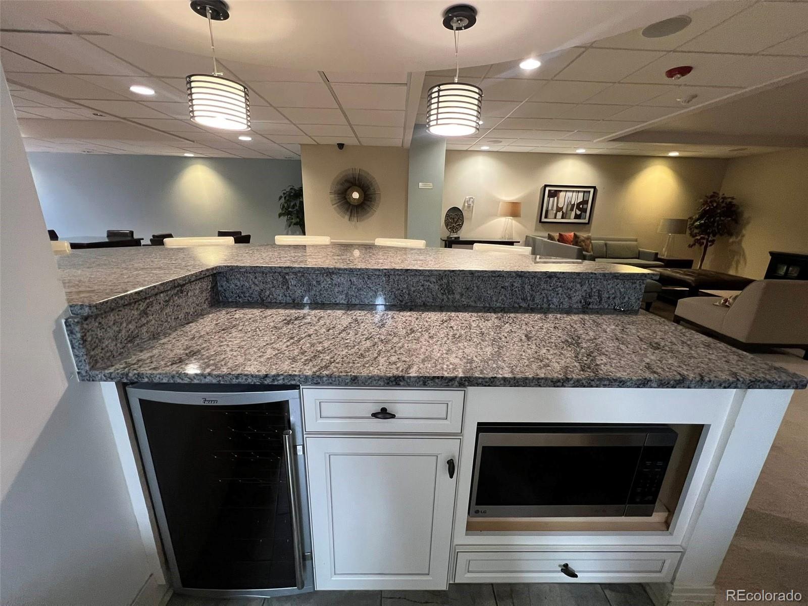 2 Adams Street, Unit 604 Denver, CO 80206 - Photo 27 of 41 a kitchen with a sink and a microwave