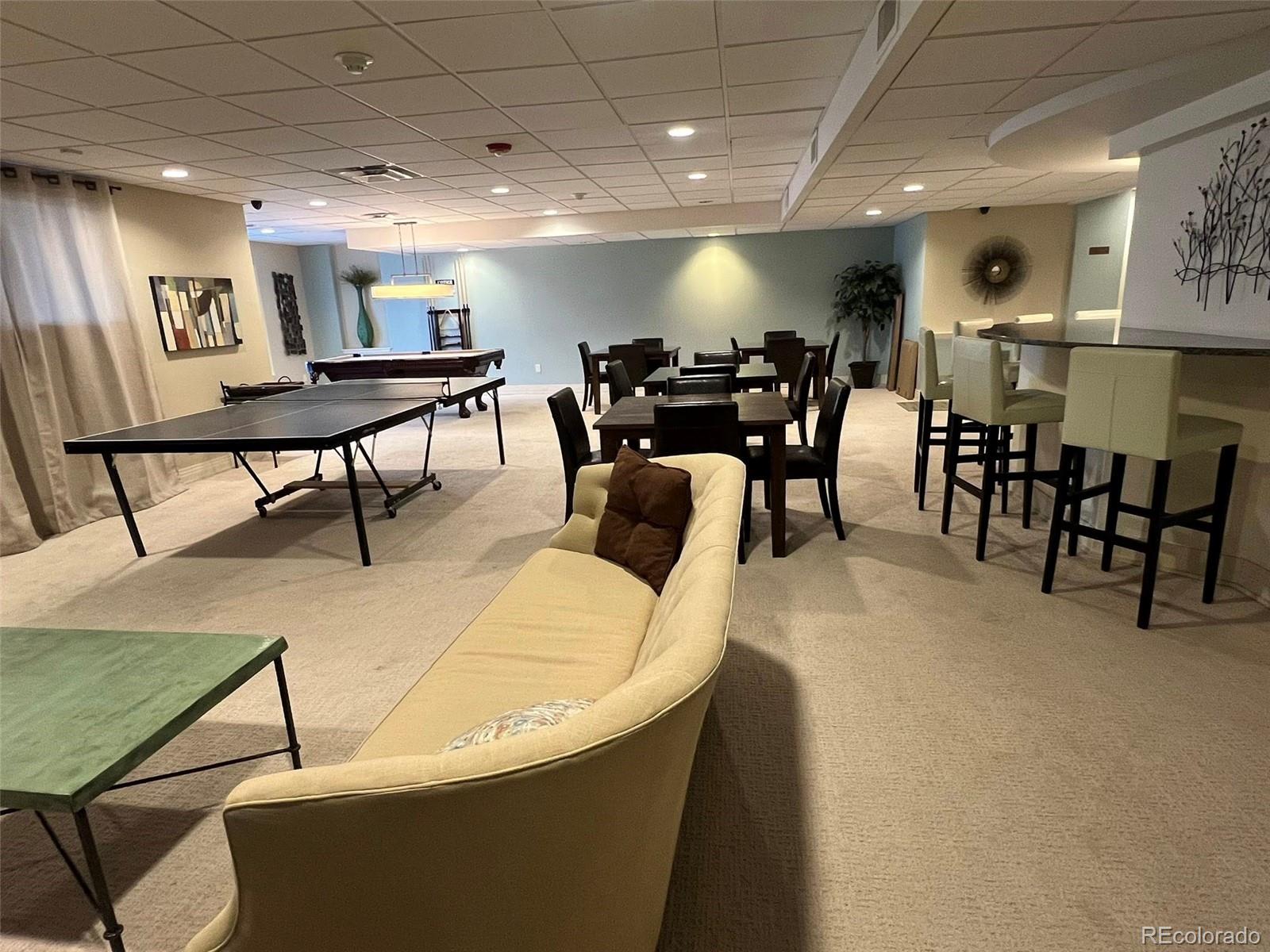 2 Adams Street, Unit 604 Denver, CO 80206 - Photo 32 of 41 a view of a dining room with furniture