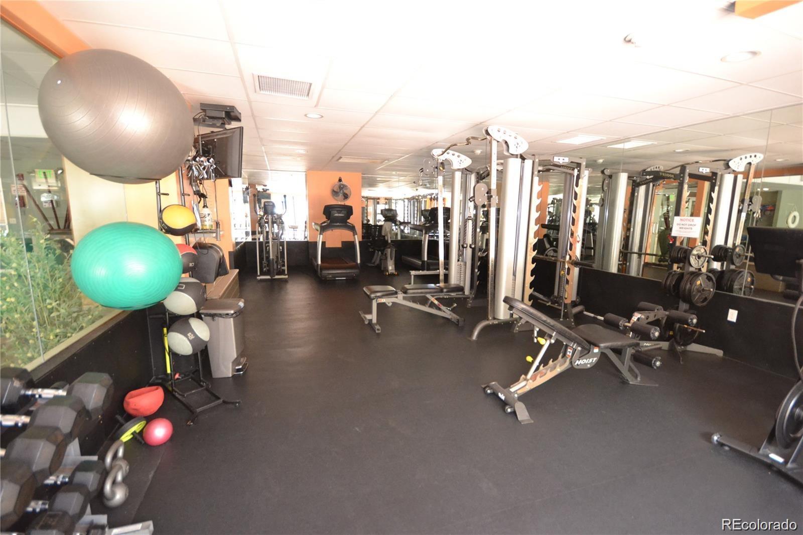 2 Adams Street, Unit 604 Denver, CO 80206 - Photo 38 of 41 a view of a room with gym equipment