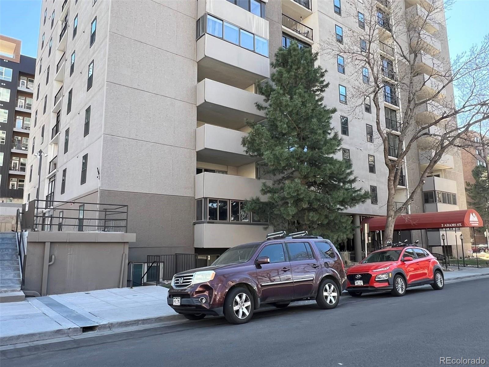 2 Adams Street, Unit 604 Denver, CO 80206 - Photo 4 of 41 a car parked in front of a building