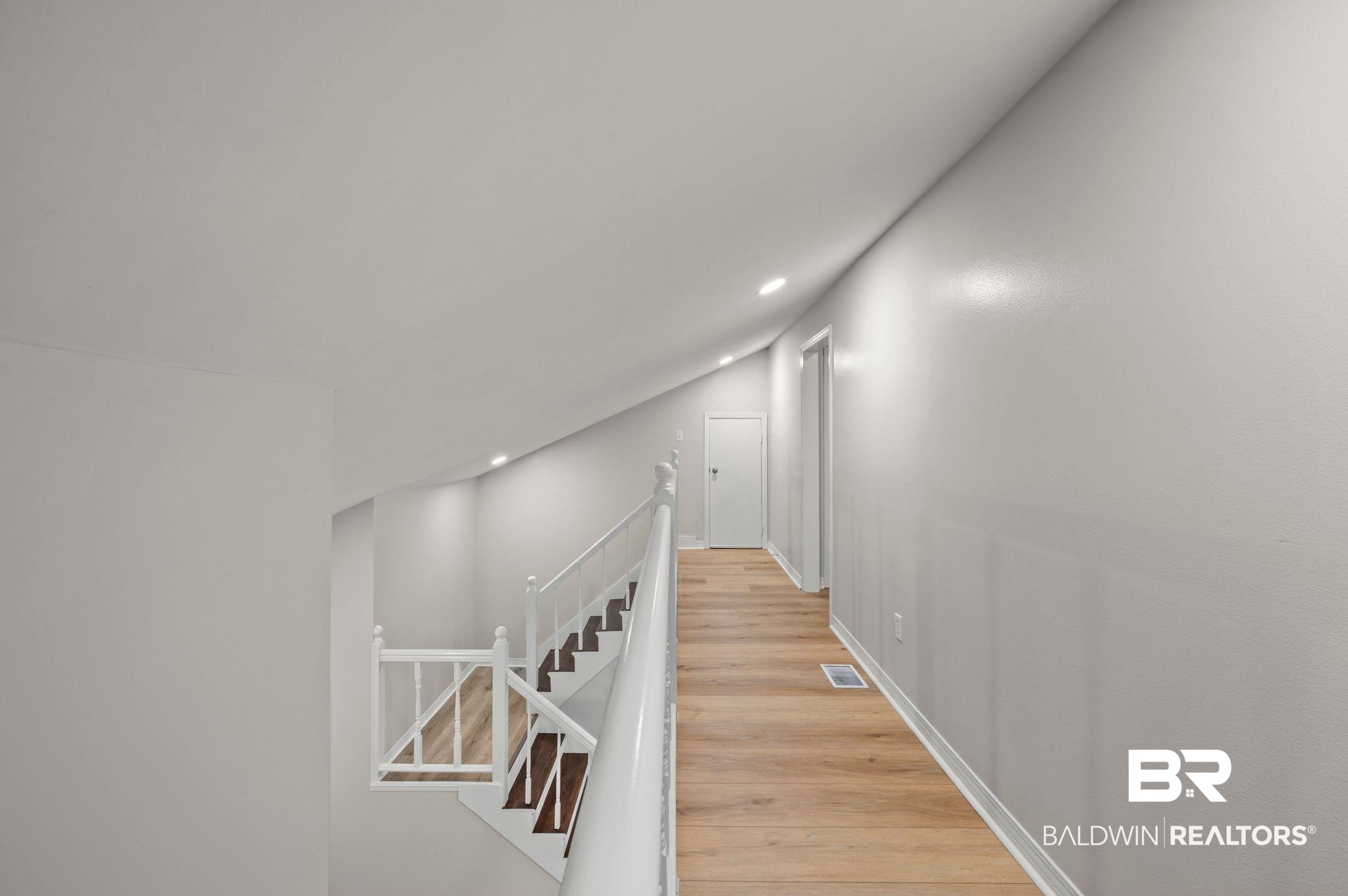 105 South Windgate Circle Daphne, AL 36526 - Photo 25 of 37 Hall featuring an upstairs landing, visible vents, baseboards, recessed lighting, and light wood-type flooring