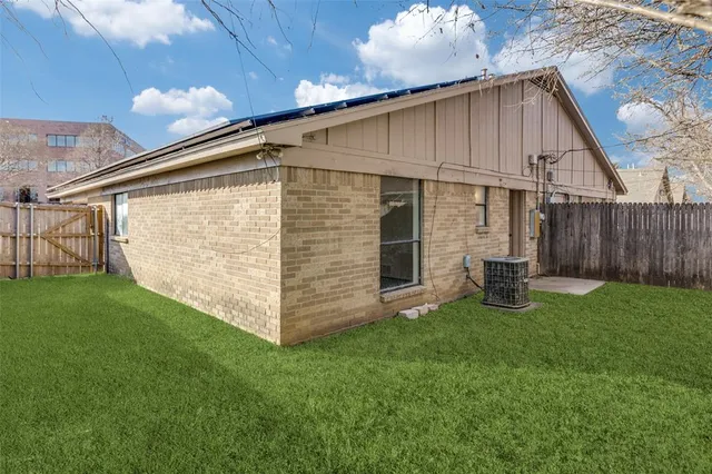 a backyard of a house with lots of green space