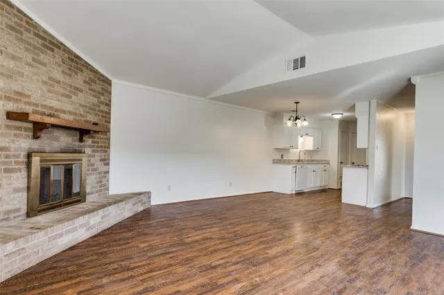 a view of a kitchen with a sink and a stove