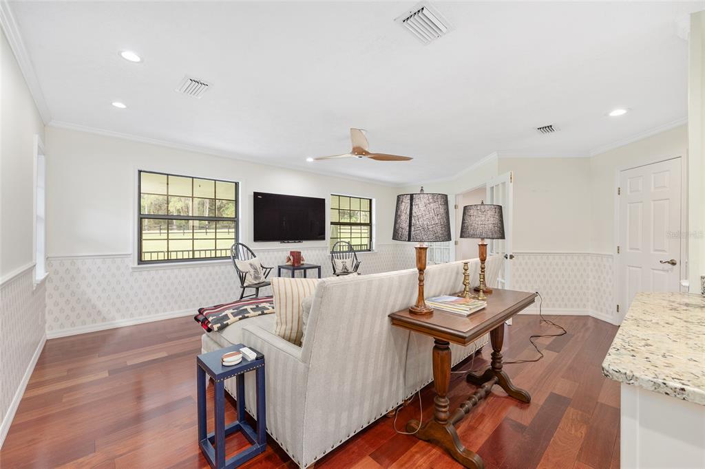 8778 Northwest 130th Street Reddick, FL 32686 - Photo 14 of 88 a living room with furniture and a flat screen tv