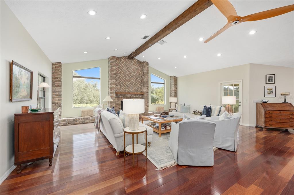 8778 Northwest 130th Street Reddick, FL 32686 - Photo 20 of 88 a living room with fireplace furniture wooden floor and a window