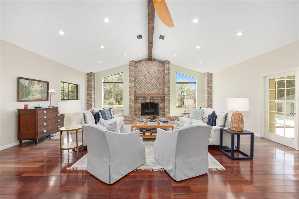 8778 Northwest 130th Street Reddick, FL 32686 - Photo 21 of 88 a living room with fireplace furniture and a wooden floor