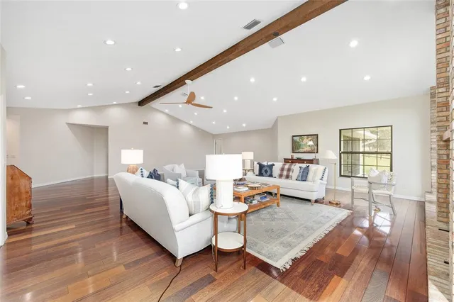a bedroom with a bed chair and piano