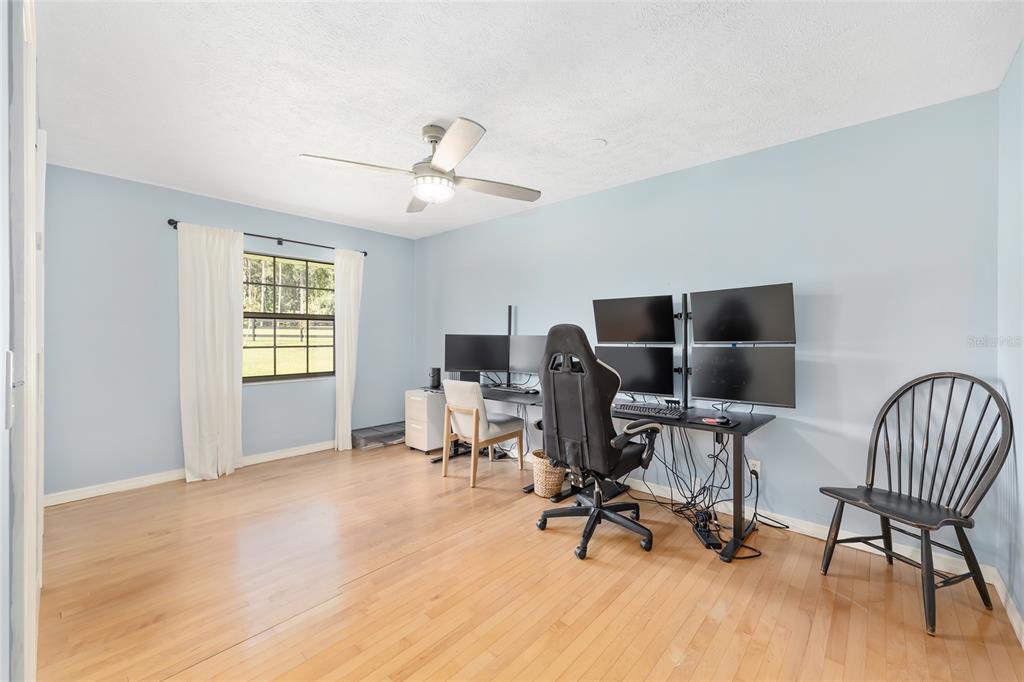 8778 Northwest 130th Street Reddick, FL 32686 - Photo 35 of 88 a view of a workspace with furniture and a window