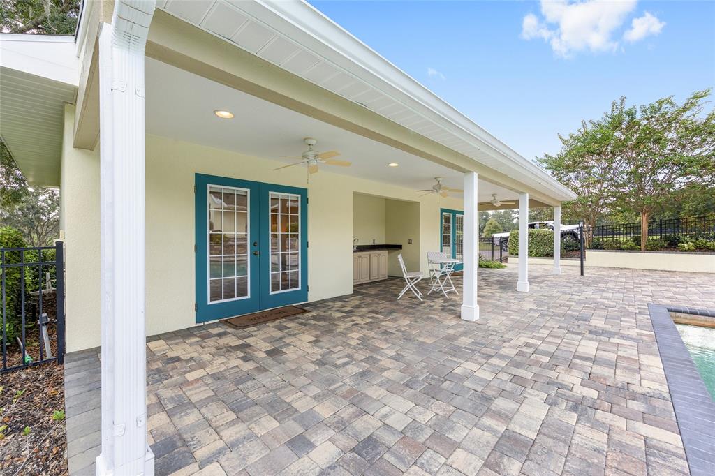 8778 Northwest 130th Street Reddick, FL 32686 - Photo 39 of 88 a view of a house with backyard porch and sitting area