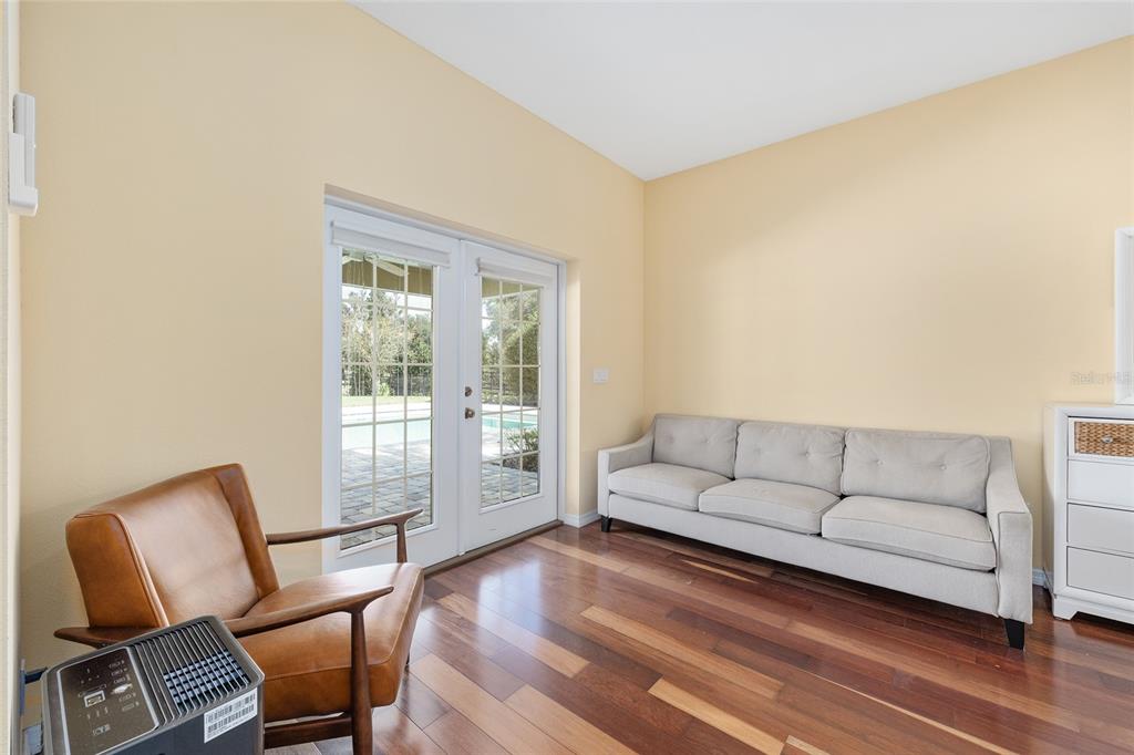 8778 Northwest 130th Street Reddick, FL 32686 - Photo 42 of 88 a living room with furniture and a floor to ceiling window