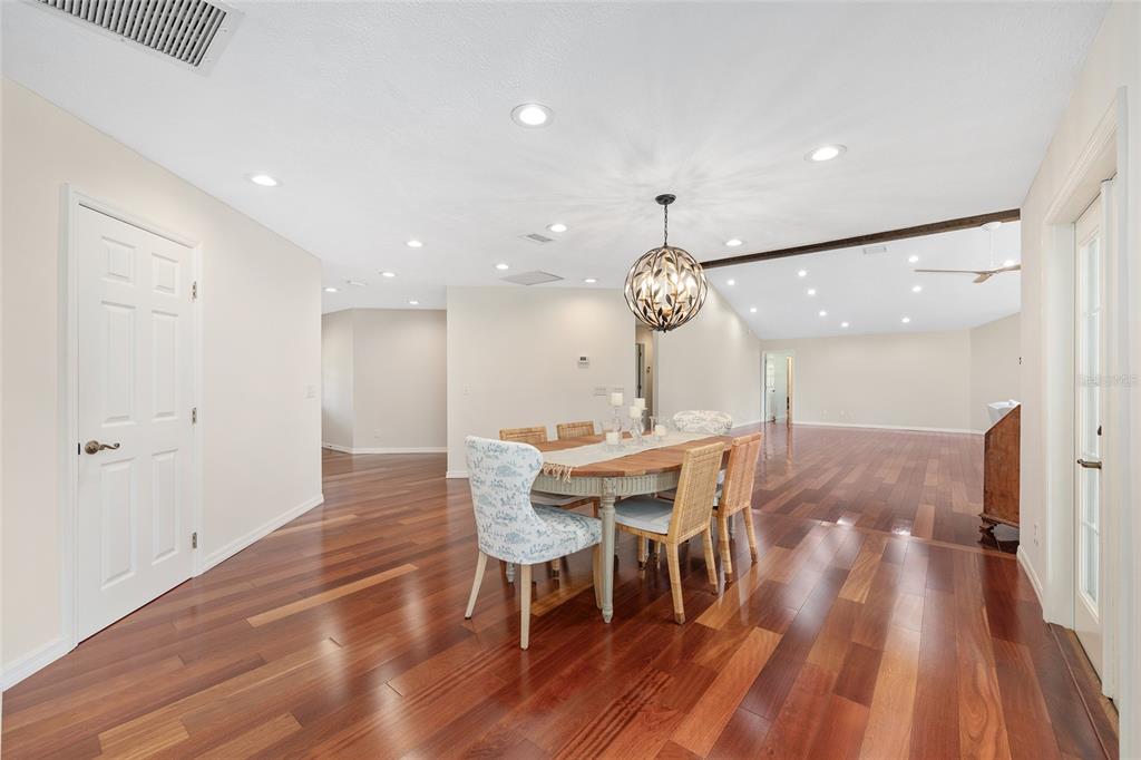 8778 Northwest 130th Street Reddick, FL 32686 - Photo 6 of 88 a view of a dining room with furniture and wooden floor