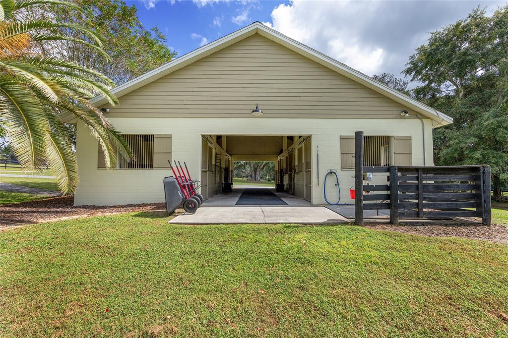 8778 Northwest 130th Street Reddick, FL 32686 - Photo 61 of 88 a view of a house with a patio and a yard