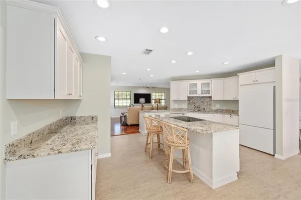 a kitchen with a table and chairs in it