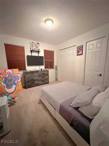 a bedroom with a bed and furniture