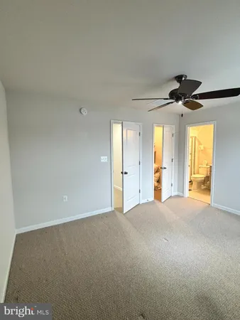 a view of an empty room and a window