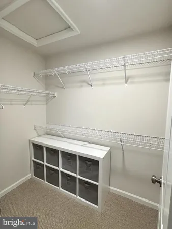 a view of an empty walk in closet