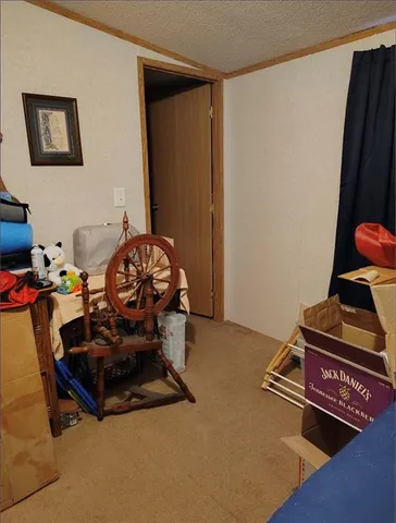 a view of a door and an empty room