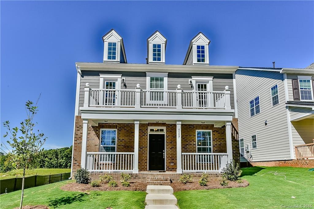 5157 Waterloo Drive, Unit CC151 Tega Cay, SC 29708 - Photo 1 of 21 a front view of a house with a yard