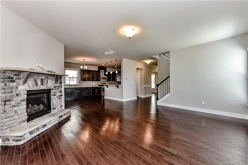 5157 Waterloo Drive, Unit CC151 Tega Cay, SC 29708 - Photo 14 of 21 a view of a living room a fireplace and wooden floor