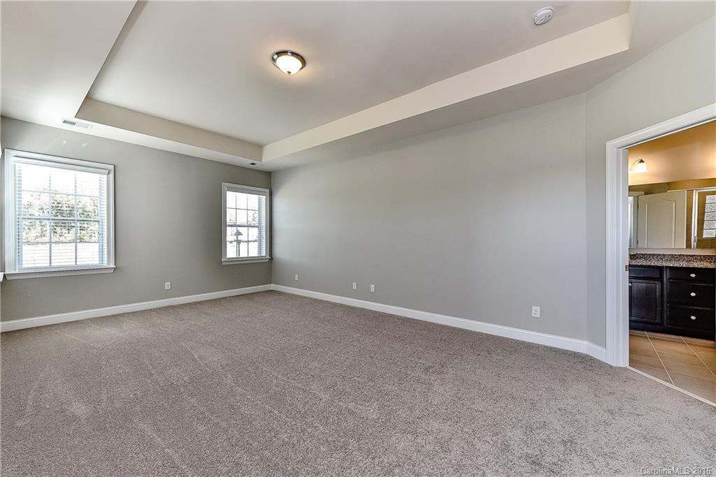 5157 Waterloo Drive, Unit CC151 Tega Cay, SC 29708 - Photo 15 of 21 an empty room with windows and closet