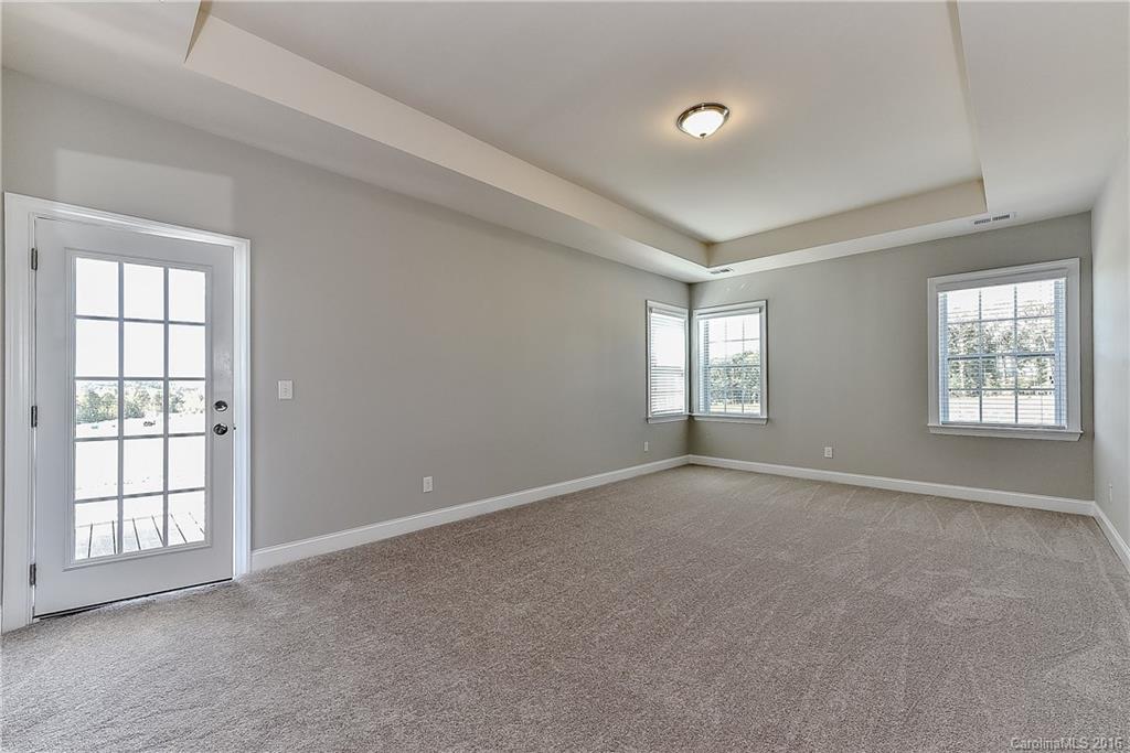 5157 Waterloo Drive, Unit CC151 Tega Cay, SC 29708 - Photo 16 of 21 a view of an empty room with a window