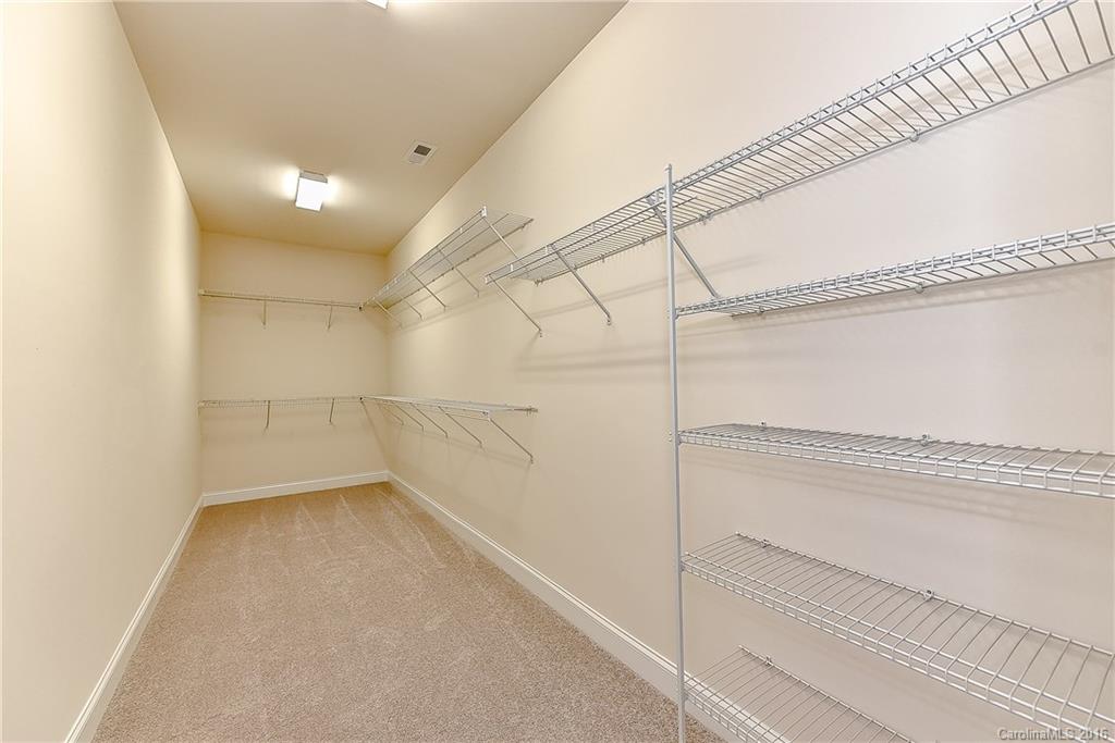 5157 Waterloo Drive, Unit CC151 Tega Cay, SC 29708 - Photo 20 of 21 a view of a room with racks on the wall