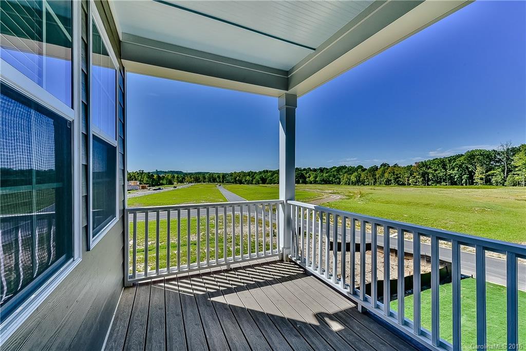 5157 Waterloo Drive, Unit CC151 Tega Cay, SC 29708 - Photo 21 of 21 a view of a balcony with yard